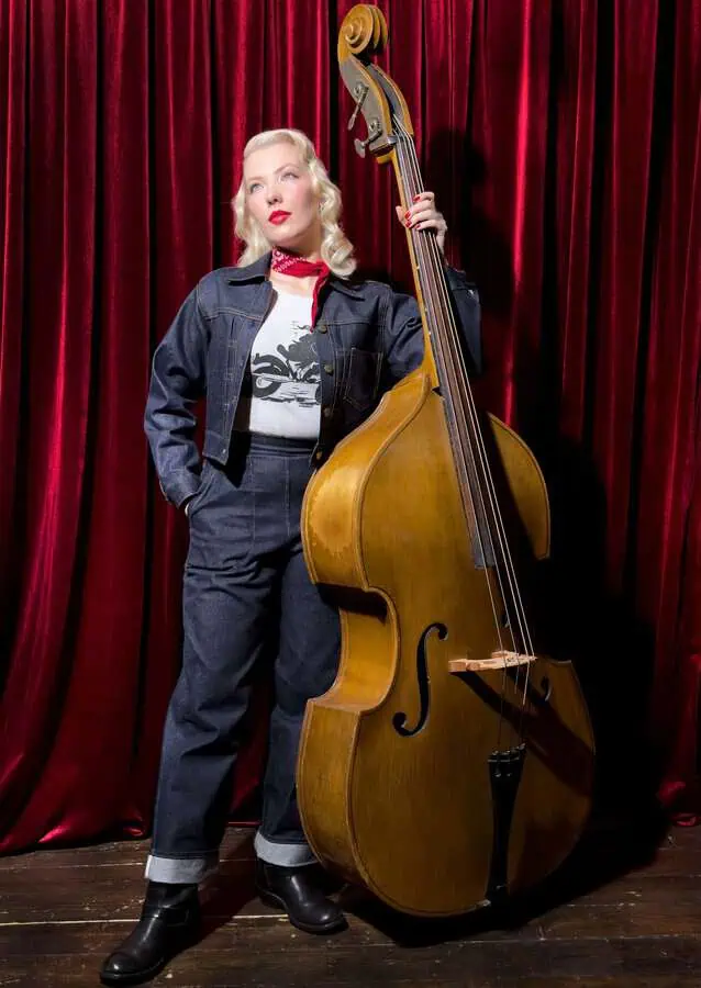 CC with a double bass wearing Golden Needle London Denim