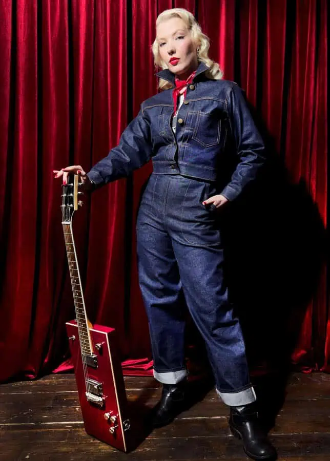 CC wih a guitar wearing Golden Needle London Denim